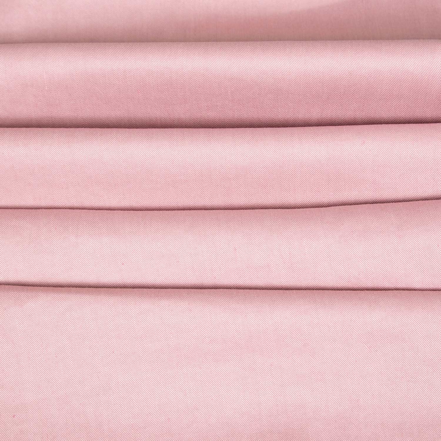 Dettaglio texture tessuto lino elasticizzato Made in Italy, naturale e leggermente stretch per blazer e completi estivi, rosa