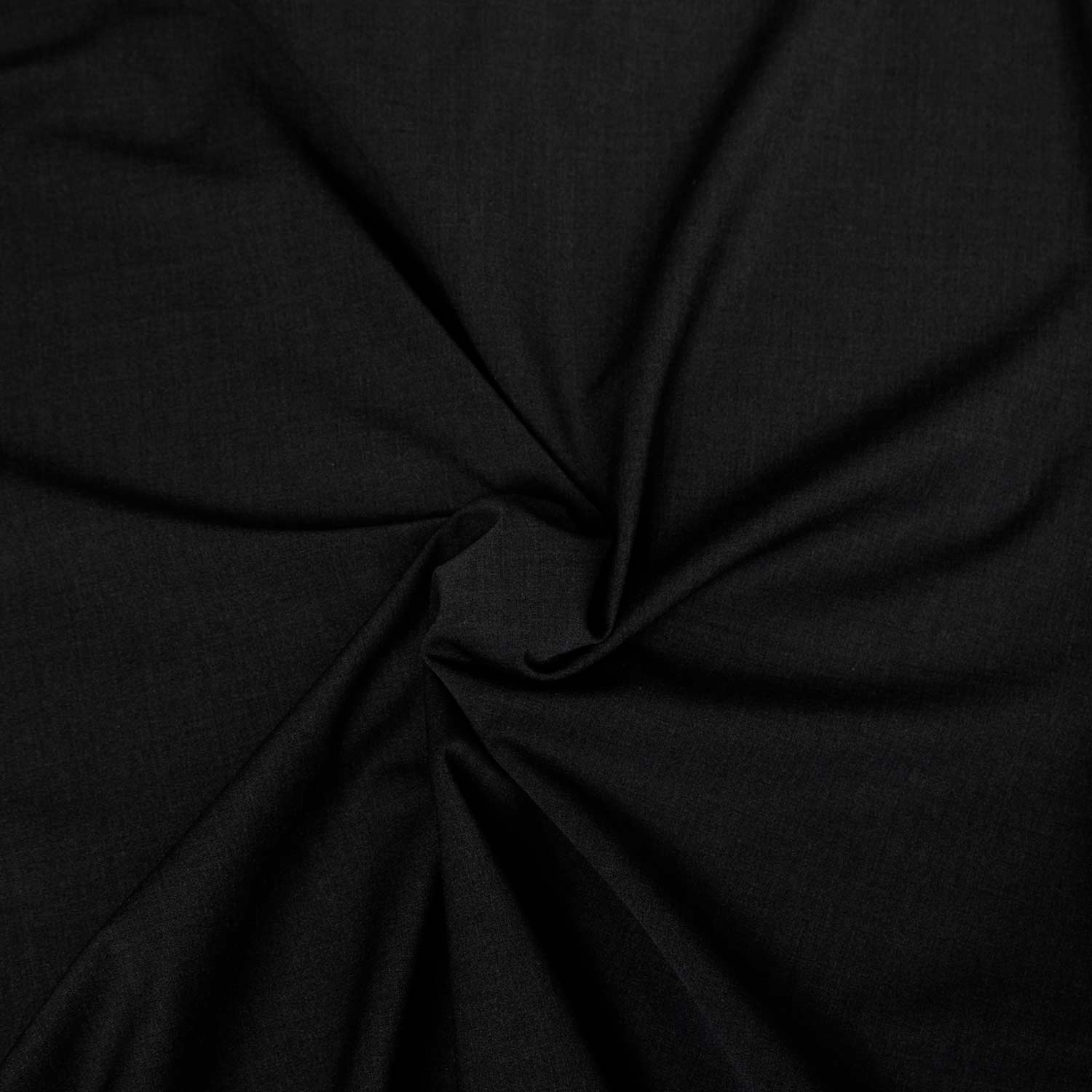 tessuto colore nero in fresco di lana Made in italy, una stoffa venduta al metro disponibile in grandi quantità. Ideale per cucire pantaloni, gonne o vestiti