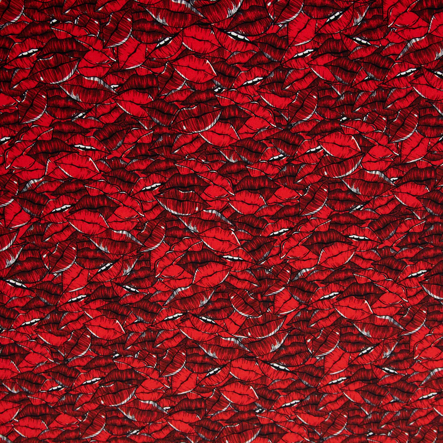 Seta stampata con pattern di labbra stilizzate, un tessuto sofisticato e creativo perfetto per abiti e realizzazioni sartoriali di alta gamma