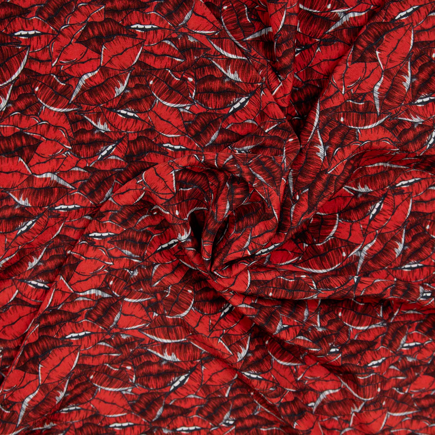 Tessuto in seta con bocche stampate che creano un pattern divertente ed elegante per realizzazioni haute couture