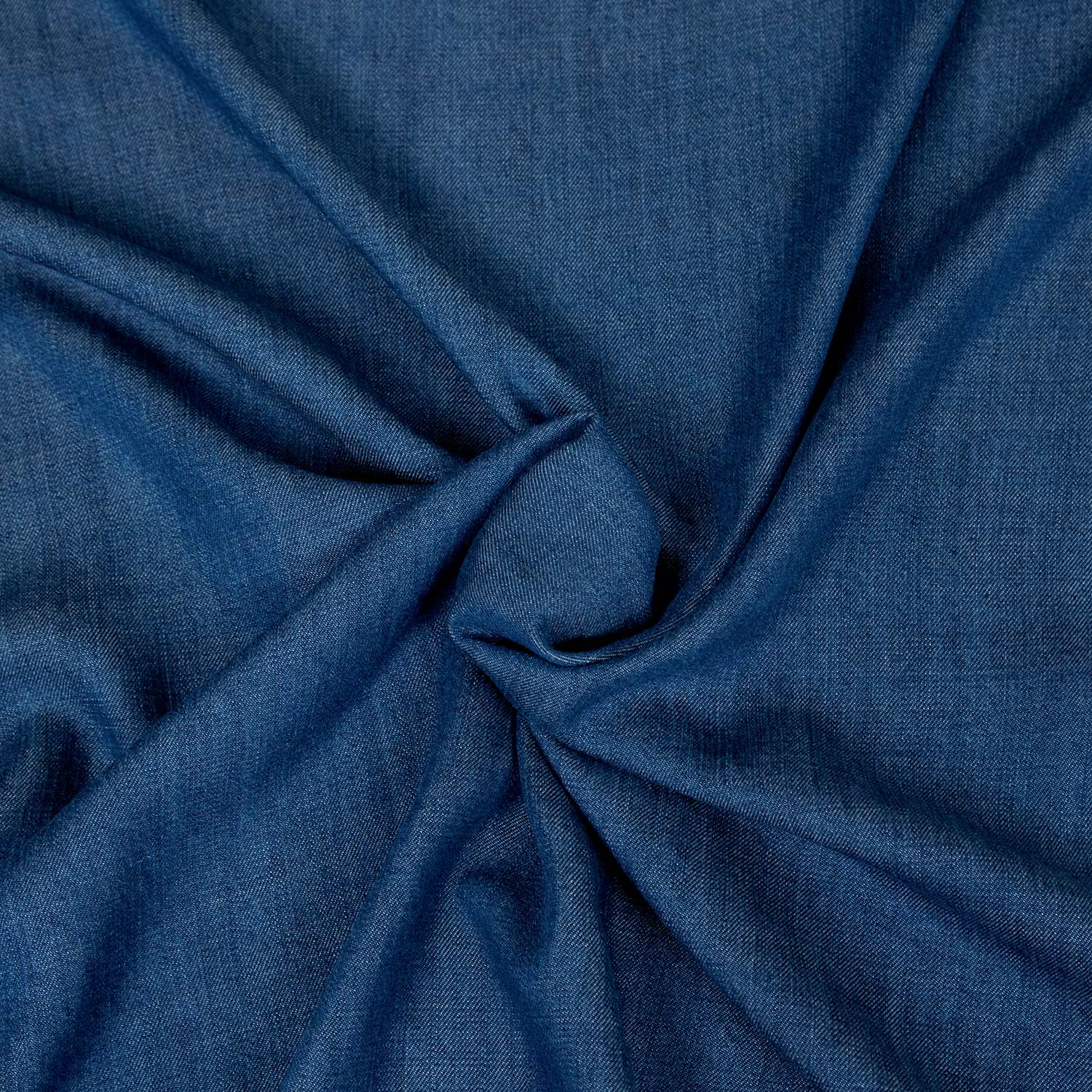 Tessuto 100% Tencel blu denim al metro, morbido, fluido e perfetto per abiti e pantaloni.