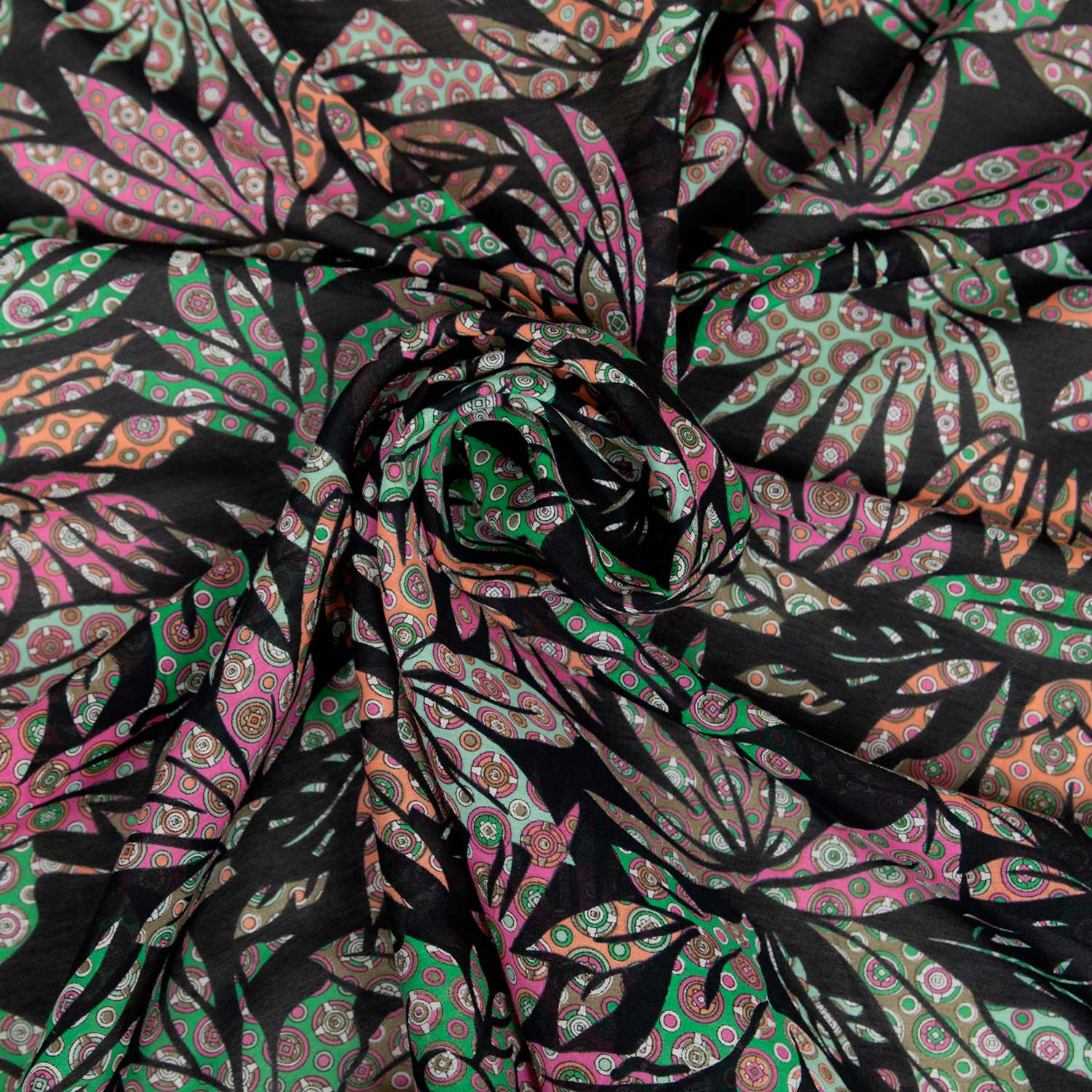 Mussola deadstock in seta e cotone su fondo nero con stampa di foglie rosa e dettagli grafici, tessuto leggero e traspirante venduto al metro.