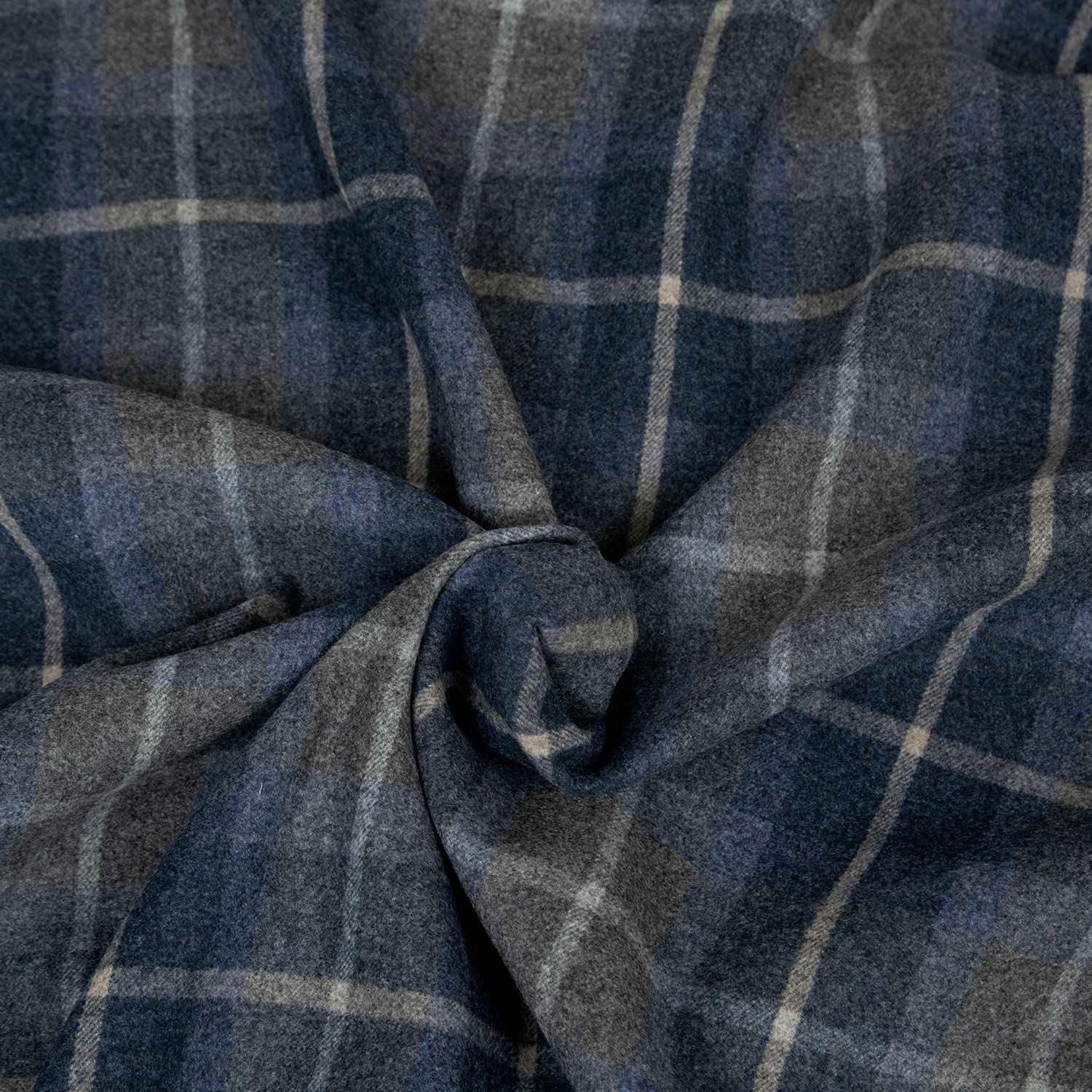 Tessuto doubleface lana e cashmere deadstock con fantasia check blu e retro tinta unita blu scuro.