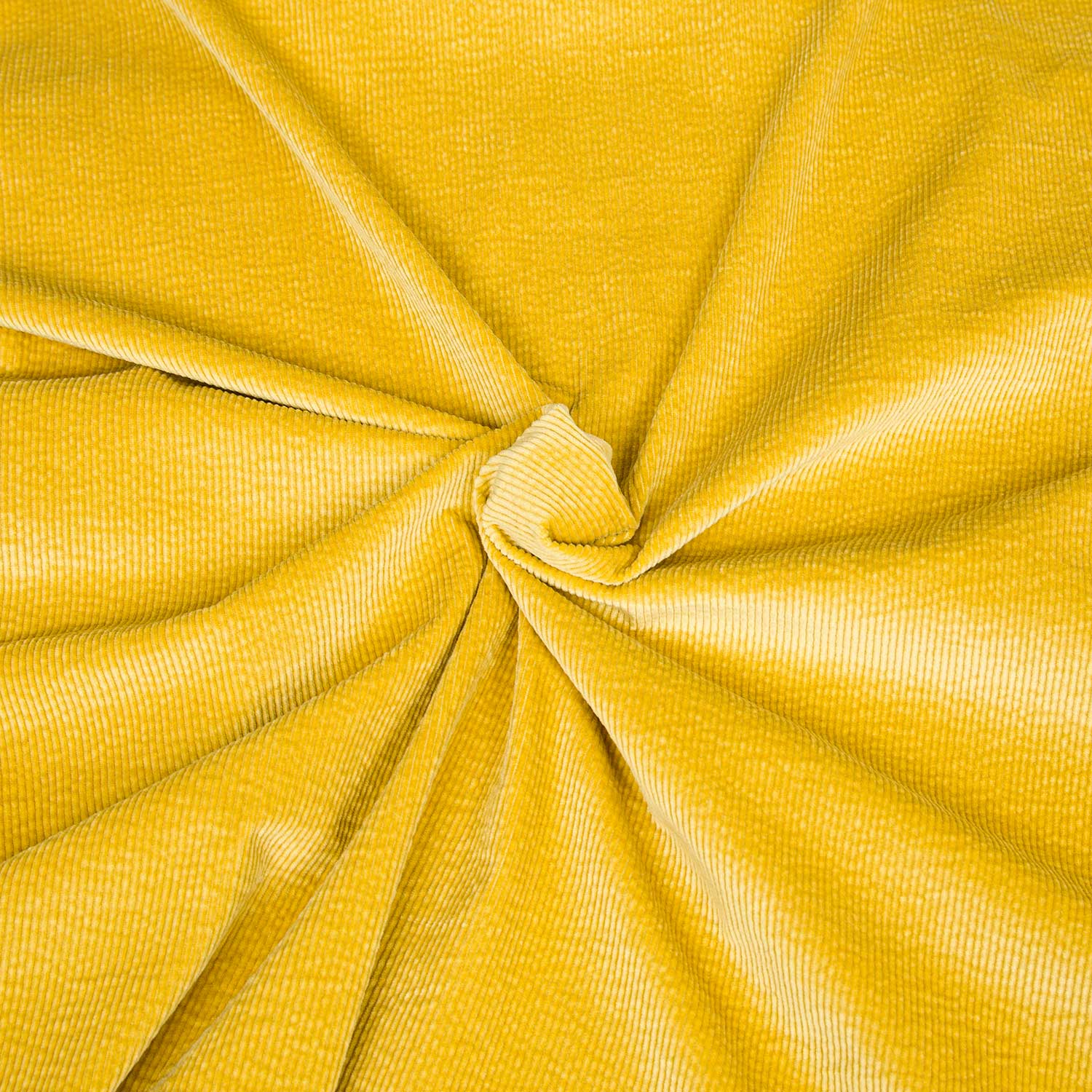 Tessuto in velluto a coste 500 righe morbido e di qualità. Una stoffa in cotone, modal ed elastane venduta al metro e sempre disponibile in grandi quantità; colore giallo acceso