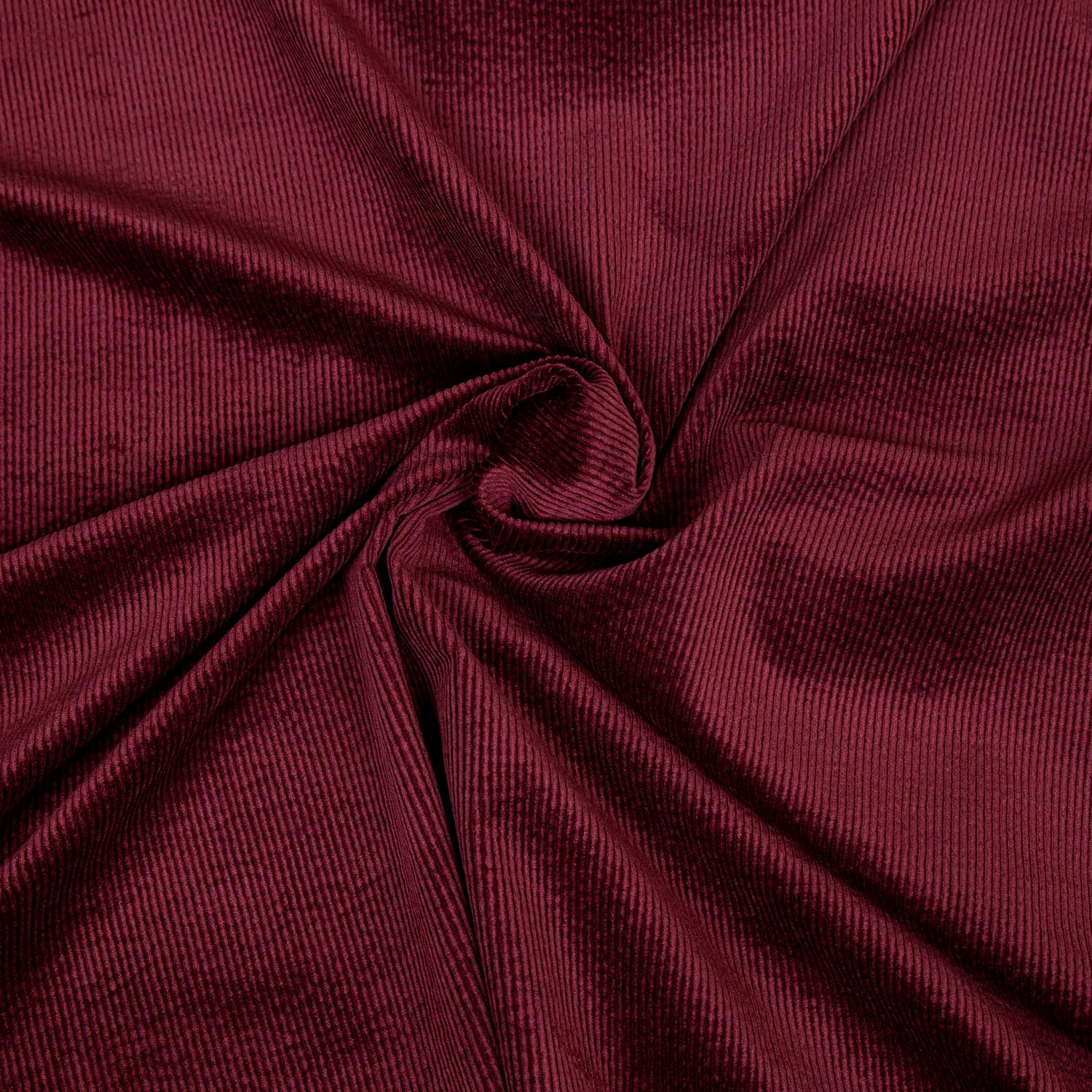 Tessuto in velluto a coste 500 righe morbido e di qualità. Una stoffa in cotone, modal ed elastane venduta al metro e sempre disponibile in grandi quantità; colore bordeaux