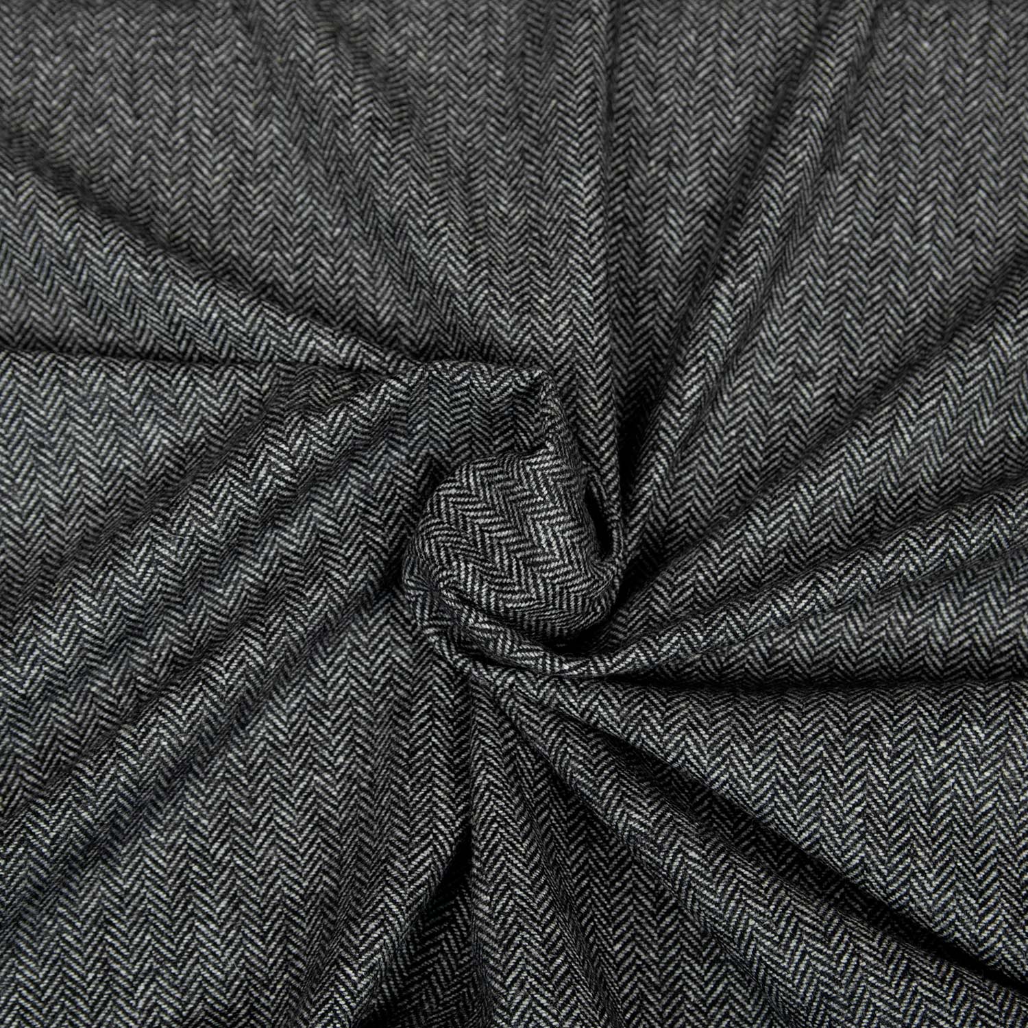 Tessuto Herringbone grigio in 100% lana riciclata con classica trama a spina di pesce inglese, morbido e caldo, ideale per giacche sartoriali.