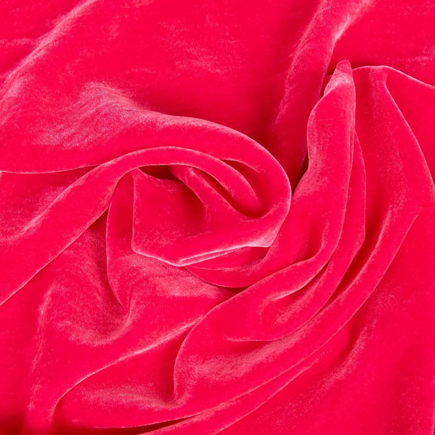 Velluto liscio panné misto seta e viscosa, un tessuto morbido, cadente e luminoso per realizzare capi d'abbigliamento eleganti. Una stoffa cangiante sui toni del rosa acceso